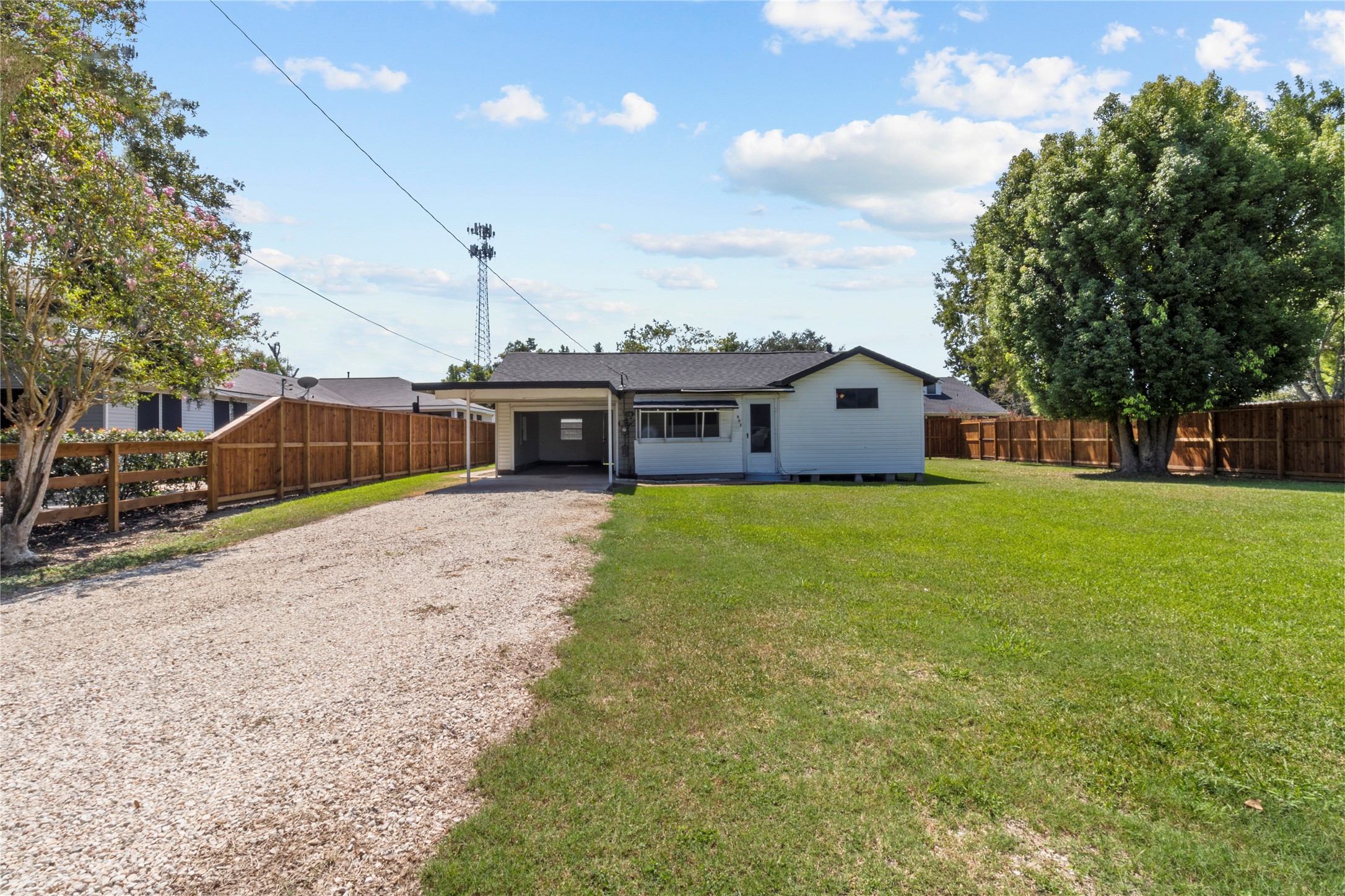 802 Collins Street Dayton, TX 77535 - Photo 11 of 12 a front view of house with yard