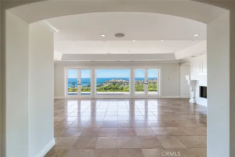 a view of entryway with a floor to ceiling window and a rug
