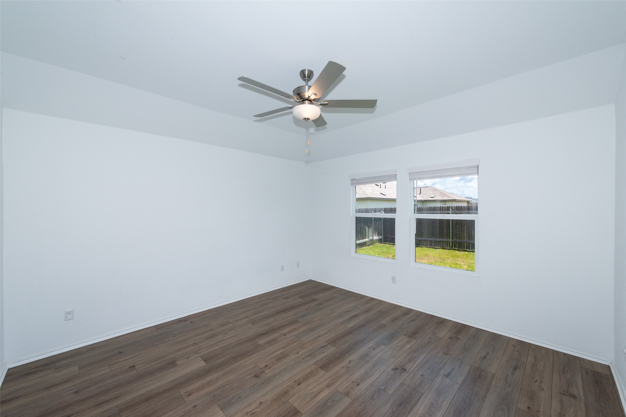 147 Otter Road Kyle, TX 78640 - Photo 22 of 34 Large Primary bedroom facing rear of property on left.