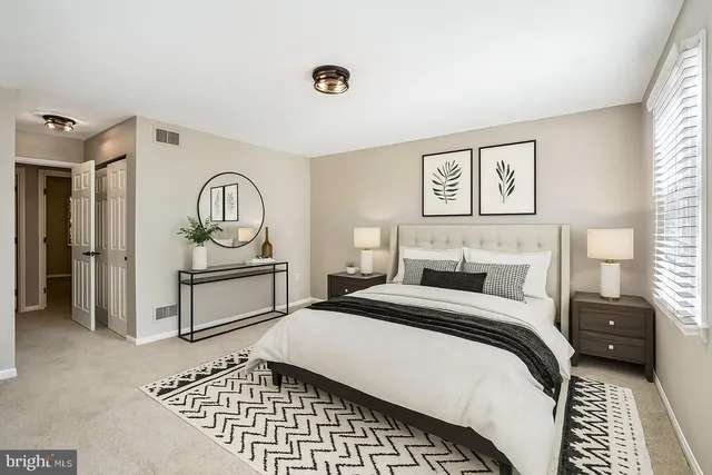 a bedroom with a bed and a view of bathroom