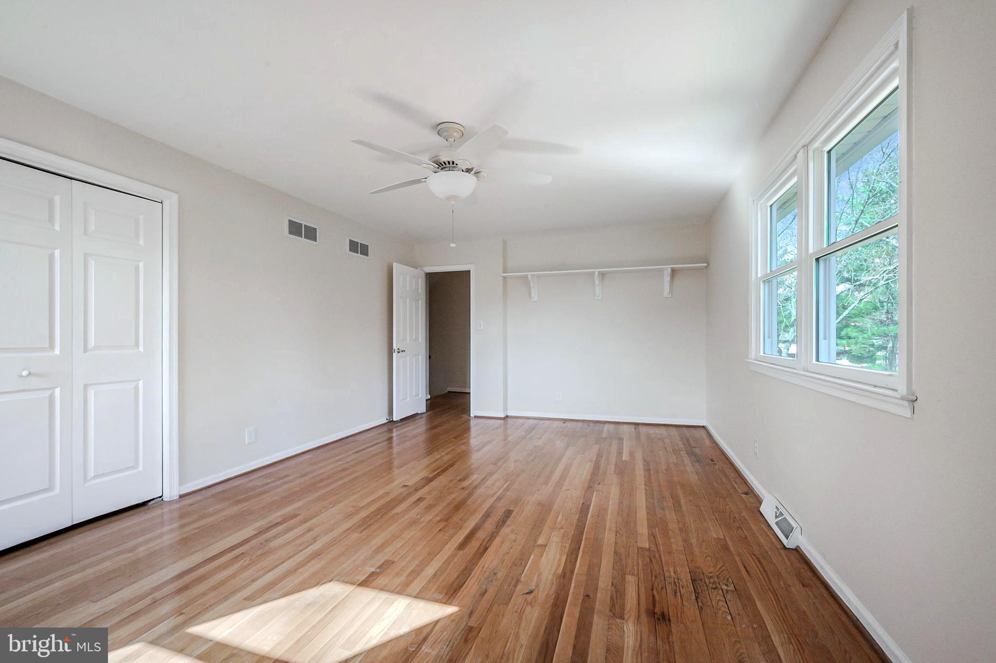4 Phoenix Drive Bear, DE 19701 - Photo 11 of 21 a view of empty room with wooden floor and fan
