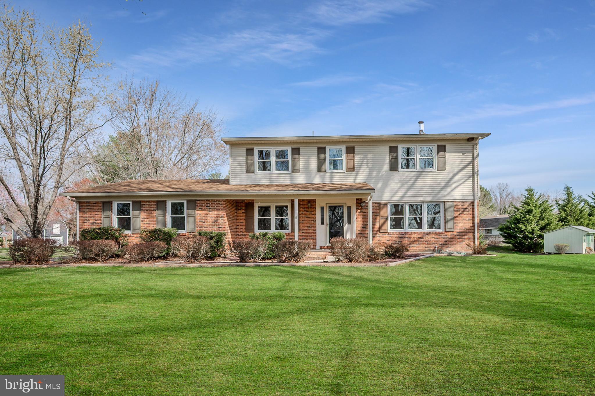 4 Phoenix Drive Bear, DE 19701 - Photo 2 of 21 a front view of a house with garden