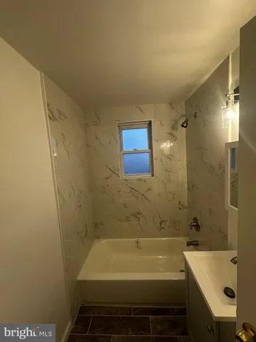 a bathroom with a sink and a bathtub