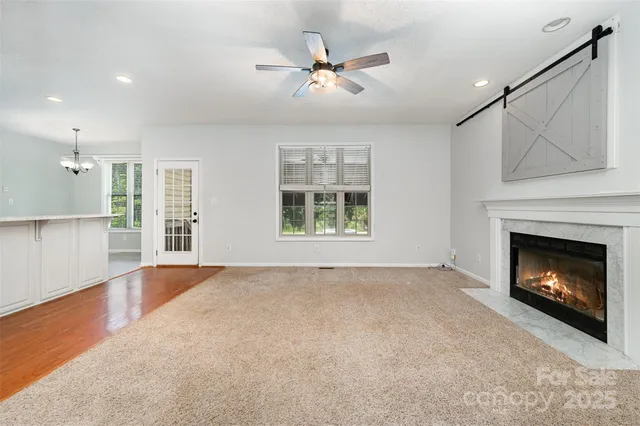 a view of a kitchen with a sink and cabinets