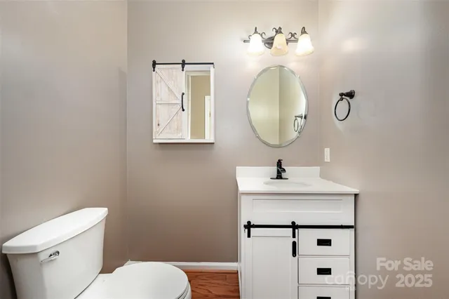 a kitchen with white cabinets and appliances