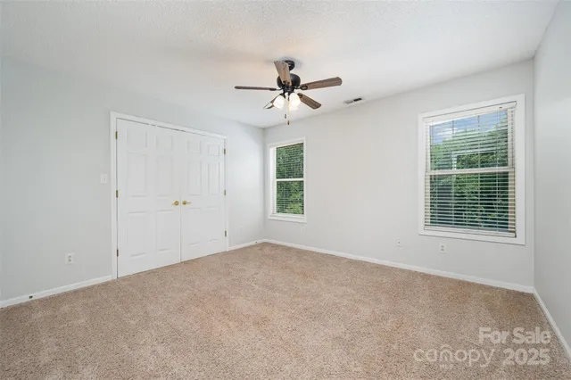 a view of a swimming pool with a yard