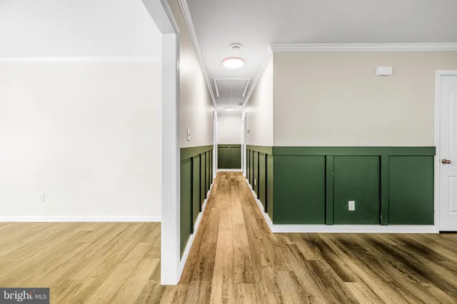 a view of a room with wooden floor and stairs