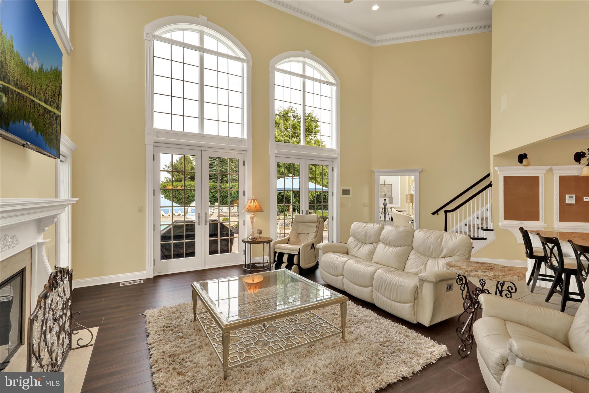1000 Bluestone Drive Lititz, PA 17543 - Photo 48 of 132 a living room with fireplace furniture and a floor to ceiling window