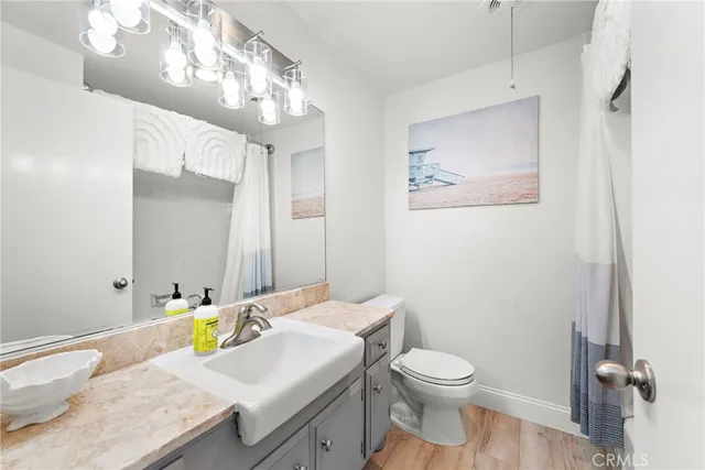 a spacious bedroom with a bed and a view of room