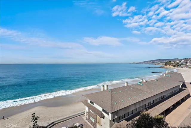 a balcony with table and chairs