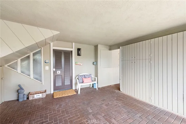 a bedroom with two large bed and a large window