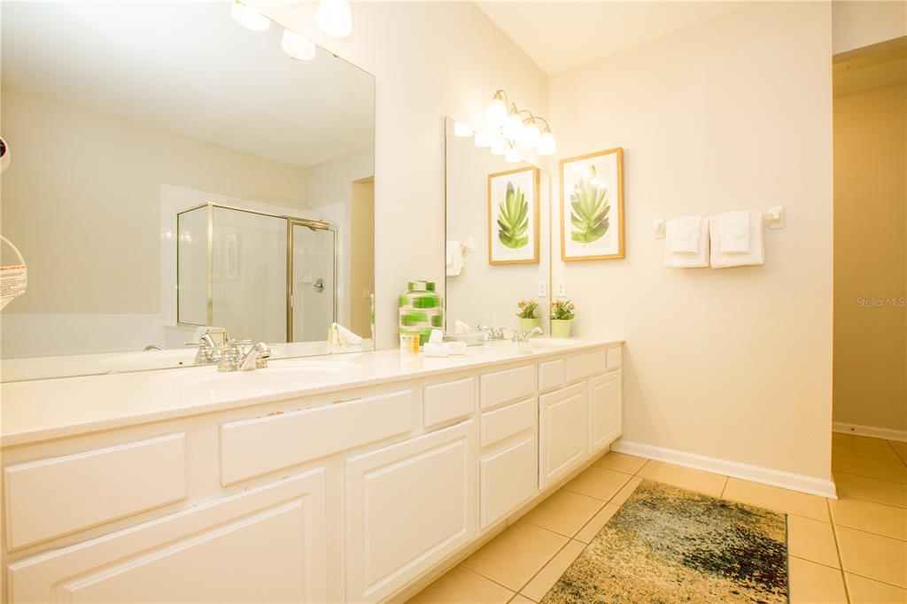5025 Shoreway Loop, Unit 105 Orlando, FL 32819 - Photo 14 of 55 a bathroom with a sink and a mirror
