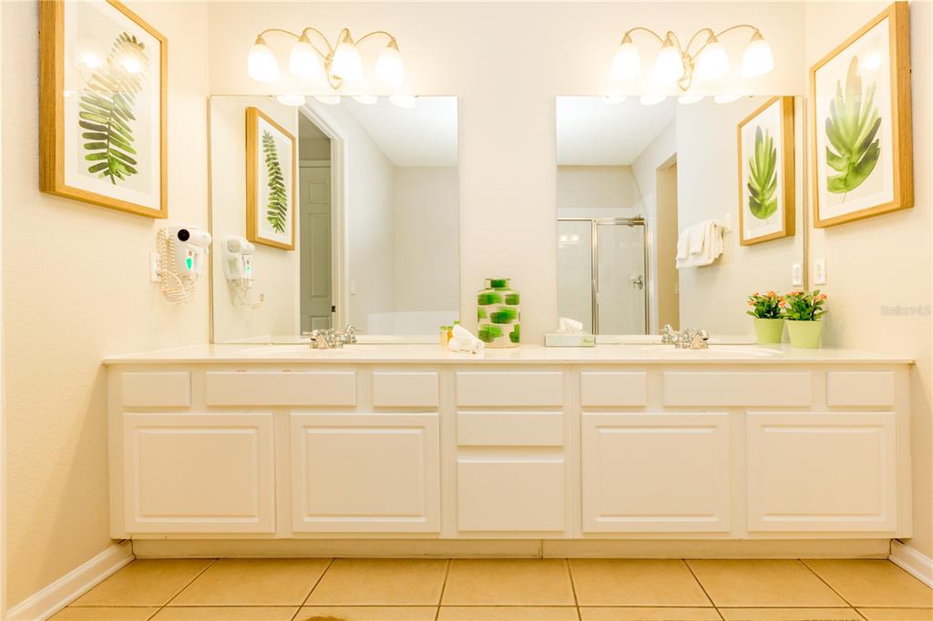 5025 Shoreway Loop, Unit 105 Orlando, FL 32819 - Photo 15 of 55 a bathroom with a sink and a mirror