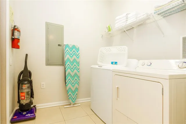 a utility room with dryer and washer