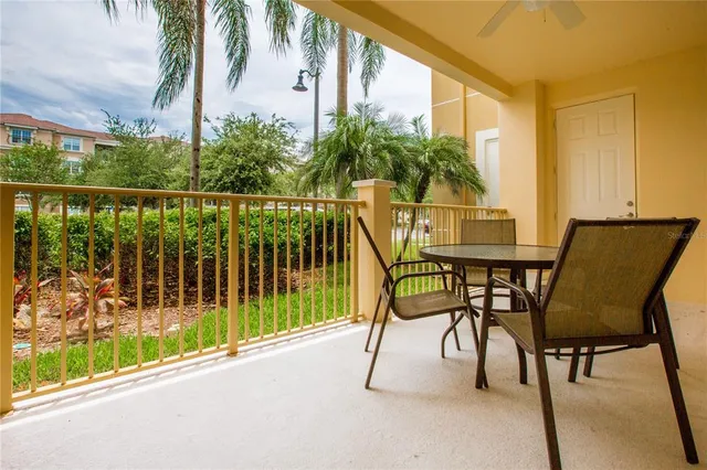 a view of a chairs and table in patio