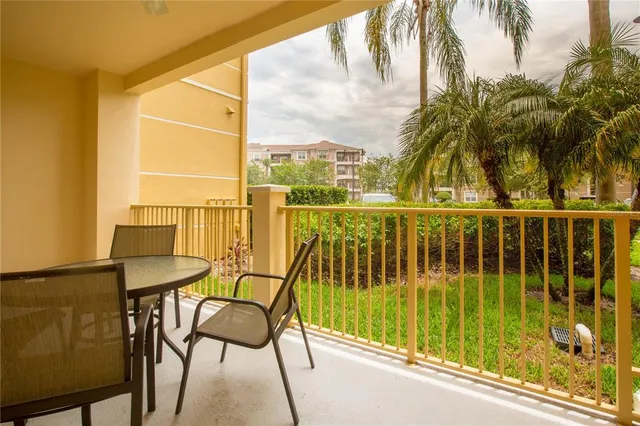 a view of a chair and table in the balcony
