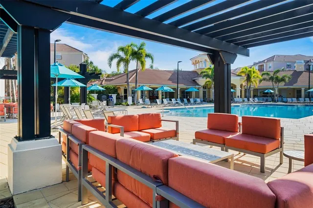 a view of a swimming pool with a lounge chairs