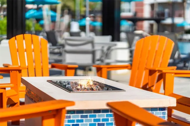 a view of swimming pool with outdoor seating