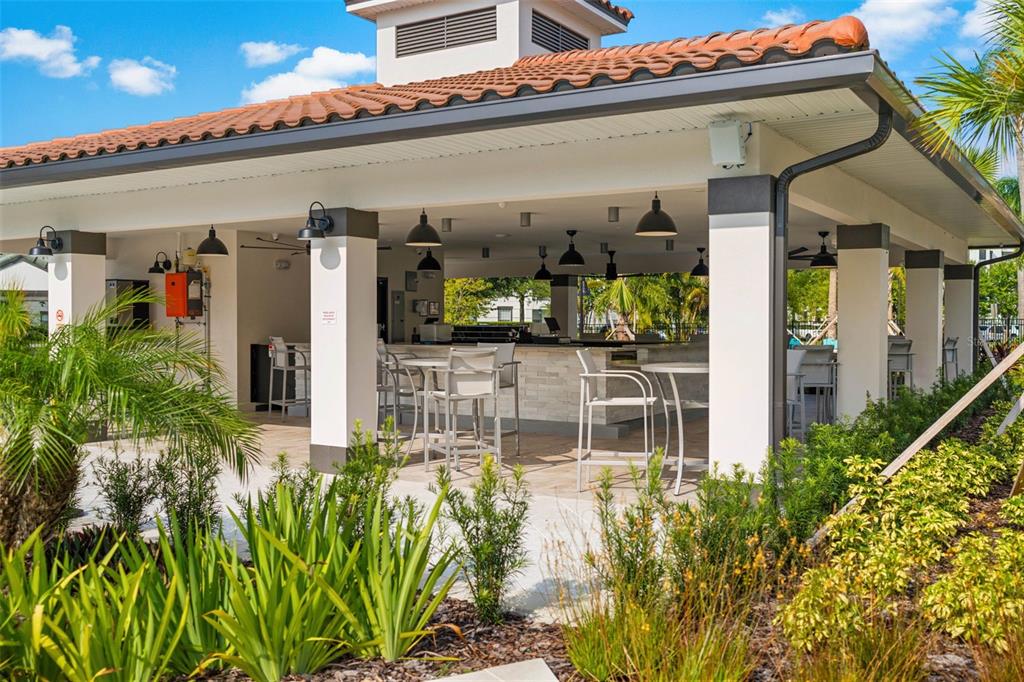 5025 Shoreway Loop, Unit 105 Orlando, FL 32819 - Photo 46 of 55 a front view of a building with garden