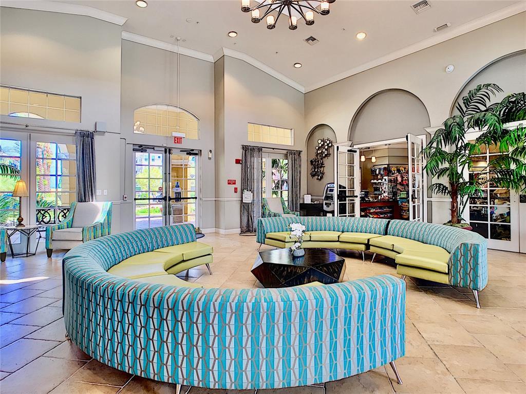 5025 Shoreway Loop, Unit 105 Orlando, FL 32819 - Photo 49 of 55 a living room with furniture and a large window