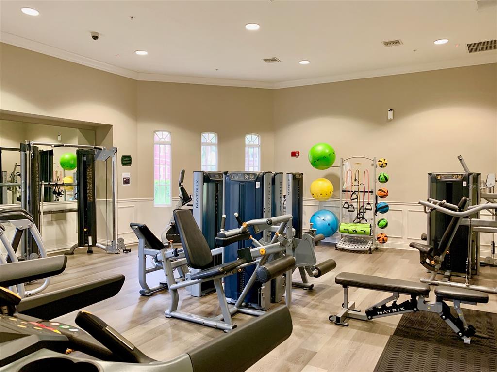 5025 Shoreway Loop, Unit 105 Orlando, FL 32819 - Photo 51 of 55 a view of a room with gym equipment