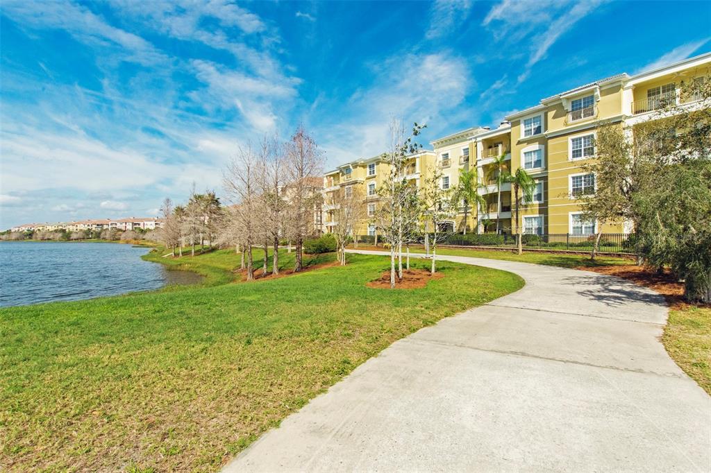 5025 Shoreway Loop, Unit 105 Orlando, FL 32819 - Photo 55 of 55 a view of yard with swimming pool