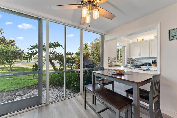 a kitchen with a table and chairs