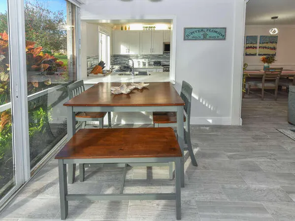 a room with table and chairs