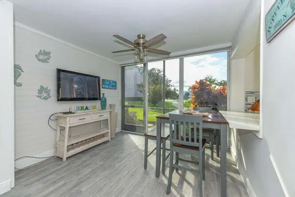 a view of a dining room with furniture window and outside view