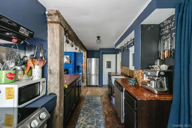 a hallway with washer and dryer