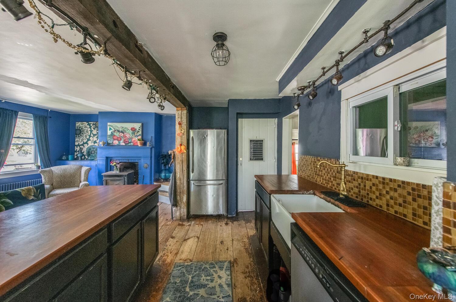 88 South Hamilton Street Poughkeepsie, NY 12601 - Photo 15 of 47 a kitchen with a counter space a sink and stainless steel appliances