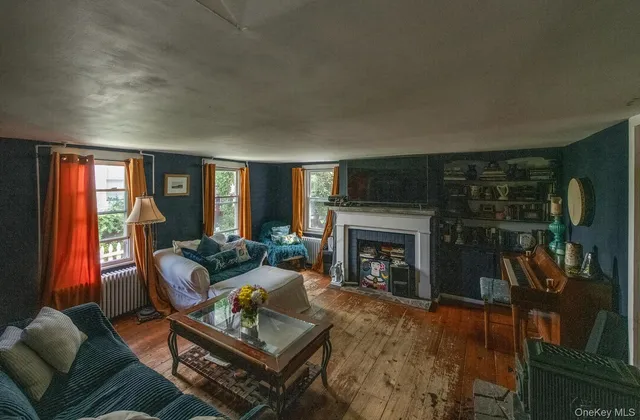 a living room with furniture and windows