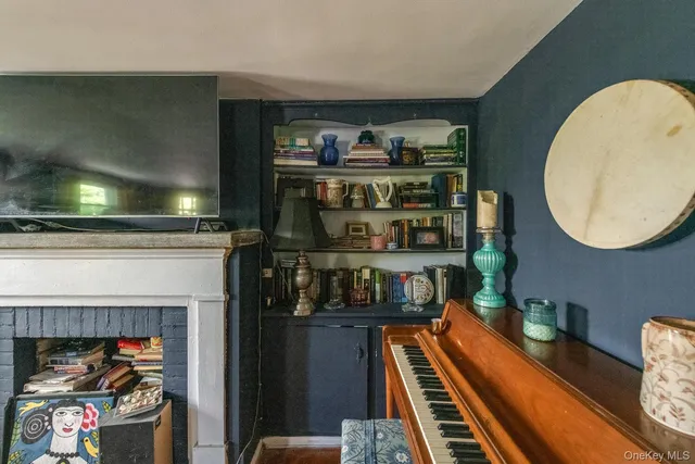 a living room with furniture rug and a window