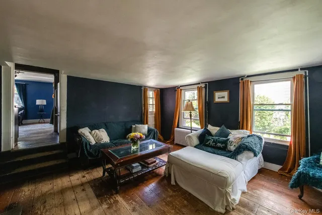 a living room with furniture fireplace and flat screen tv