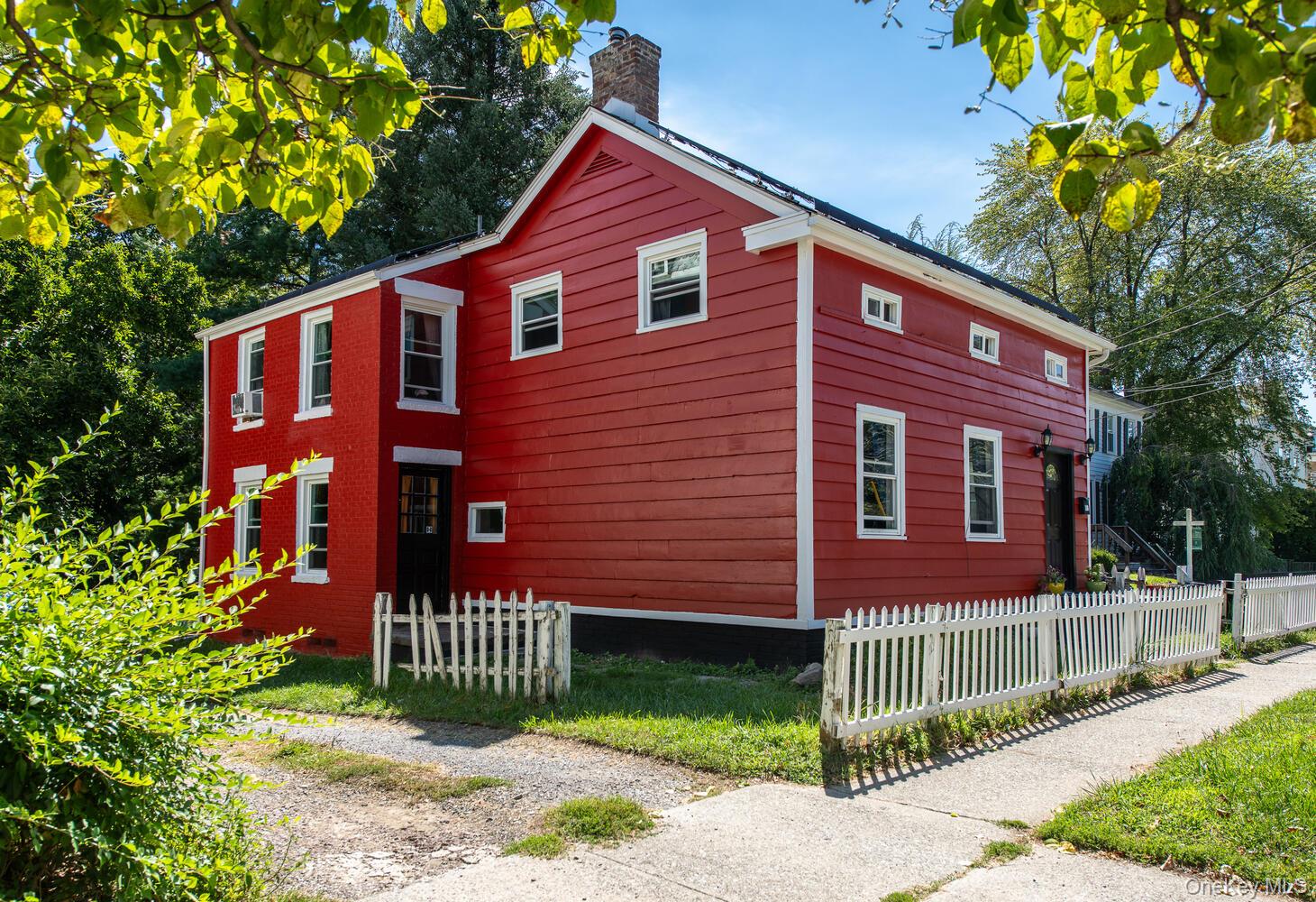 88 South Hamilton Street Poughkeepsie, NY 12601 - Photo 2 of 47 a front view of a house with a garden