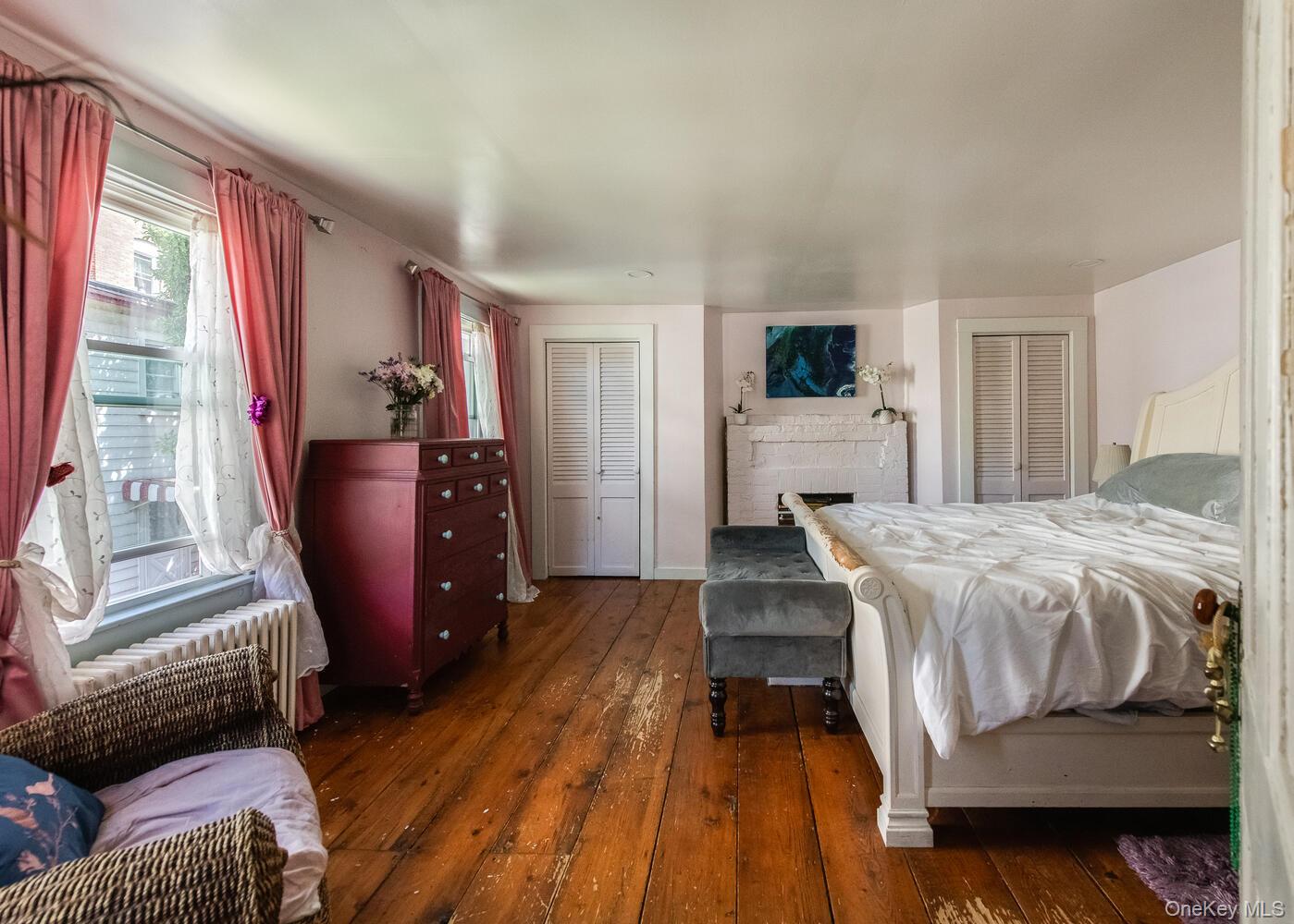 88 South Hamilton Street Poughkeepsie, NY 12601 - Photo 25 of 47 a bedroom with a bed and wooden floor