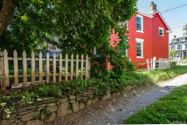 a view of a house with a tree
