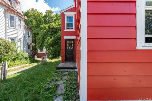 a view of a house with a small yard