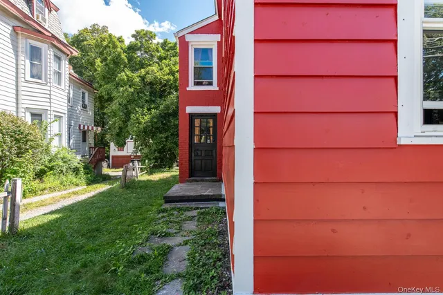 a view of a house with a small yard