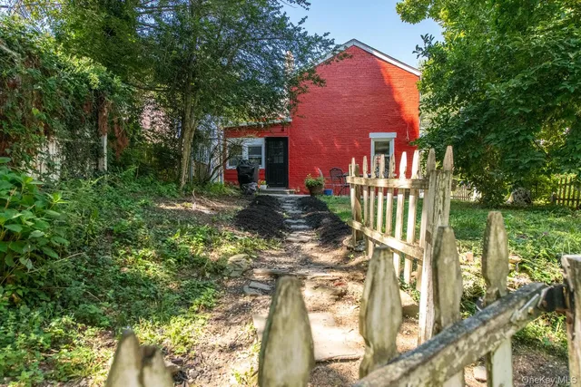 a view of a sitting area with furniture in backyard