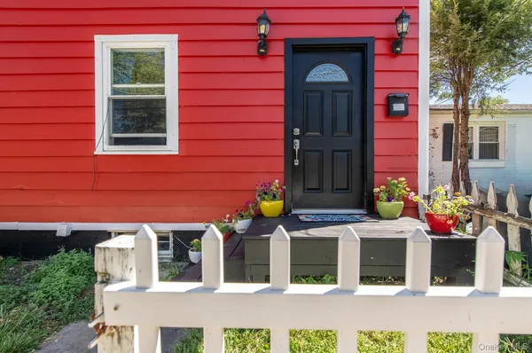 front view of a brick house with a large windows