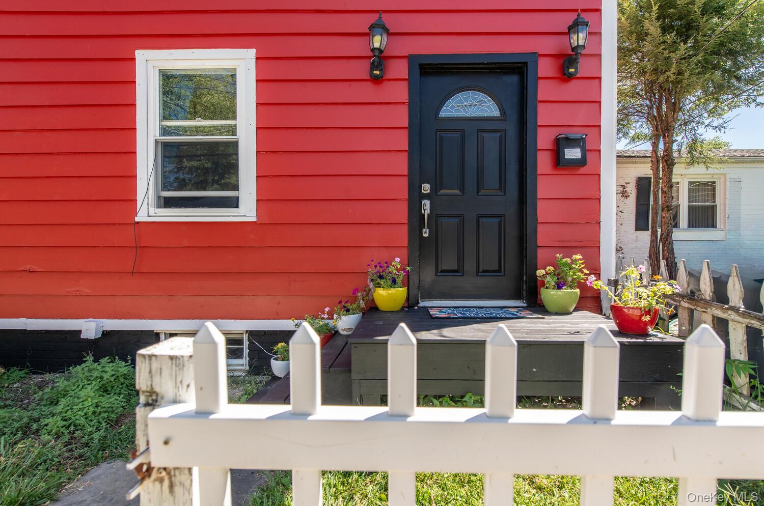 88 South Hamilton Street Poughkeepsie, NY 12601 - Photo 5 of 47 front view of a brick house with a large windows