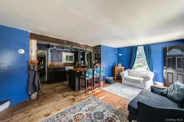 a living room with furniture and a rug