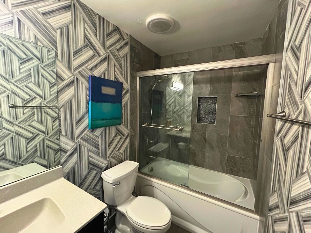 1206 New Wilke Road, Unit 206 Arlington Heights, IL 60005 - Photo 10 of 17 a bathroom with a toilet and a shower