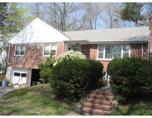 37 Risley Road Brookline, MA 02467 - Photo 1 of 3 a front view of house with yard and green space