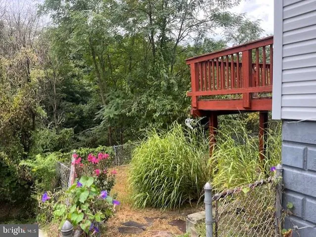 a wooden fence with some flowers