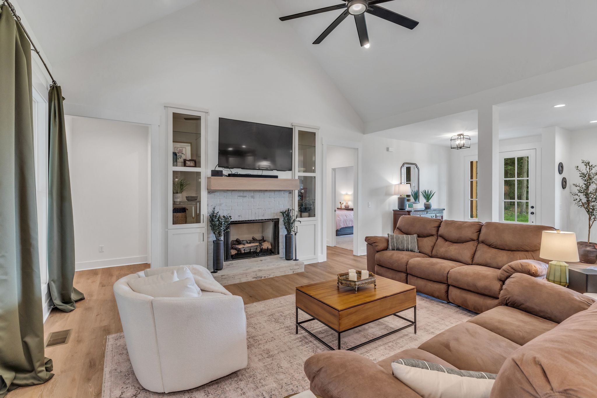 8921 Cedar Grove Road Cross Plains, TN 37049 - Photo 13 of 50 a living room with furniture a flat screen tv and a fireplace