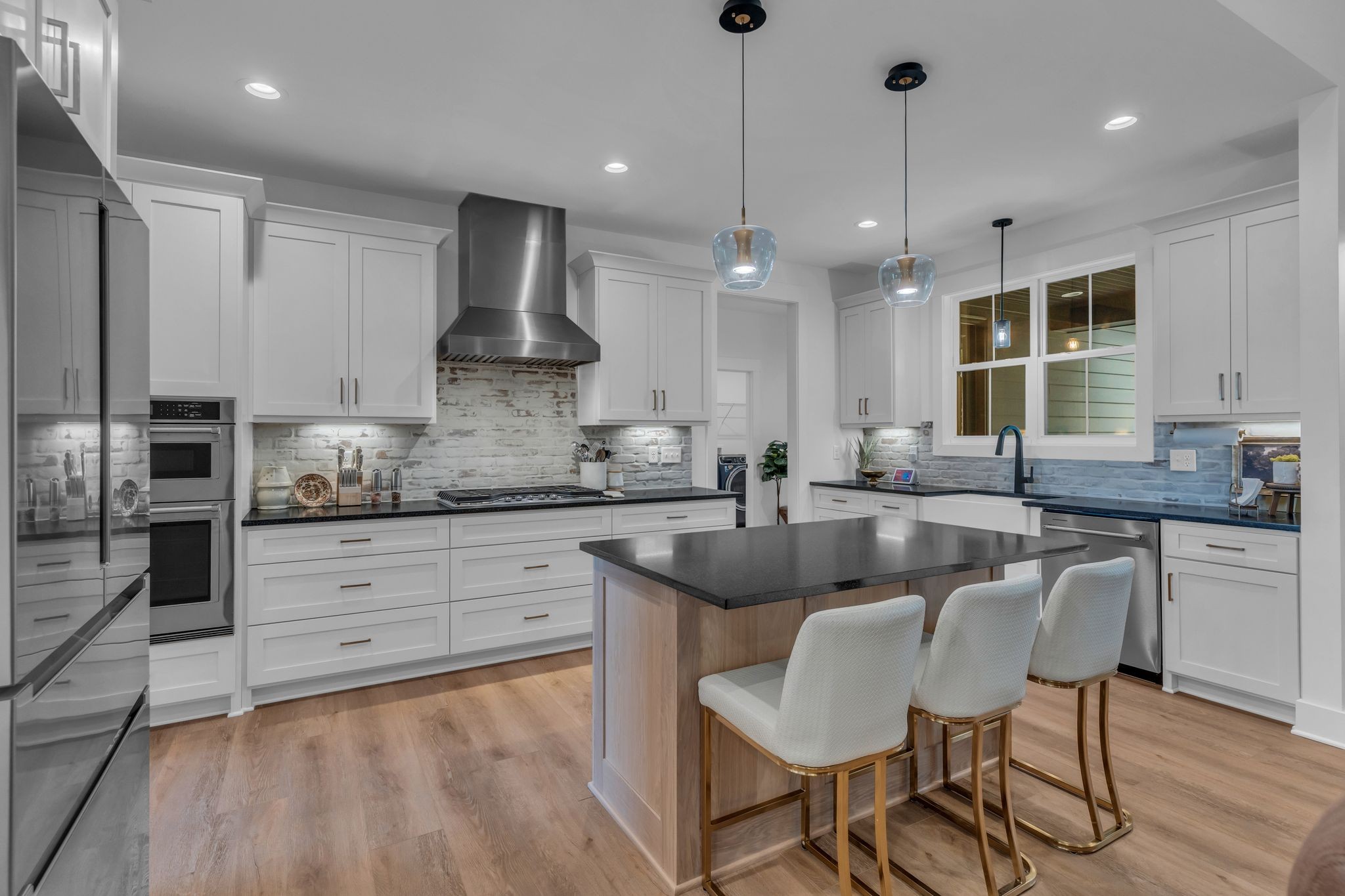 8921 Cedar Grove Road Cross Plains, TN 37049 - Photo 15 of 50 a kitchen with stainless steel appliances granite countertop a stove a sink island and a refrigerator