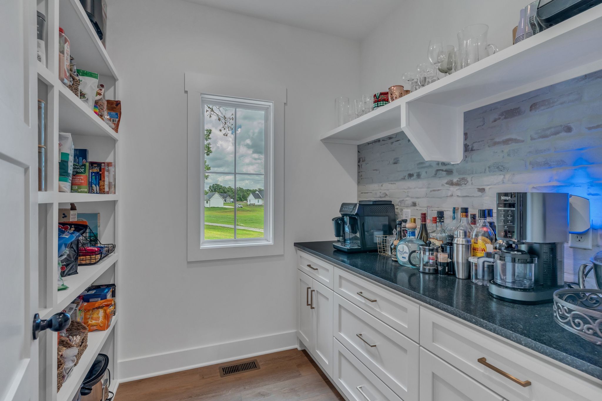 8921 Cedar Grove Road Cross Plains, TN 37049 - Photo 19 of 50 a kitchen with lots of counter top space and wooden floor