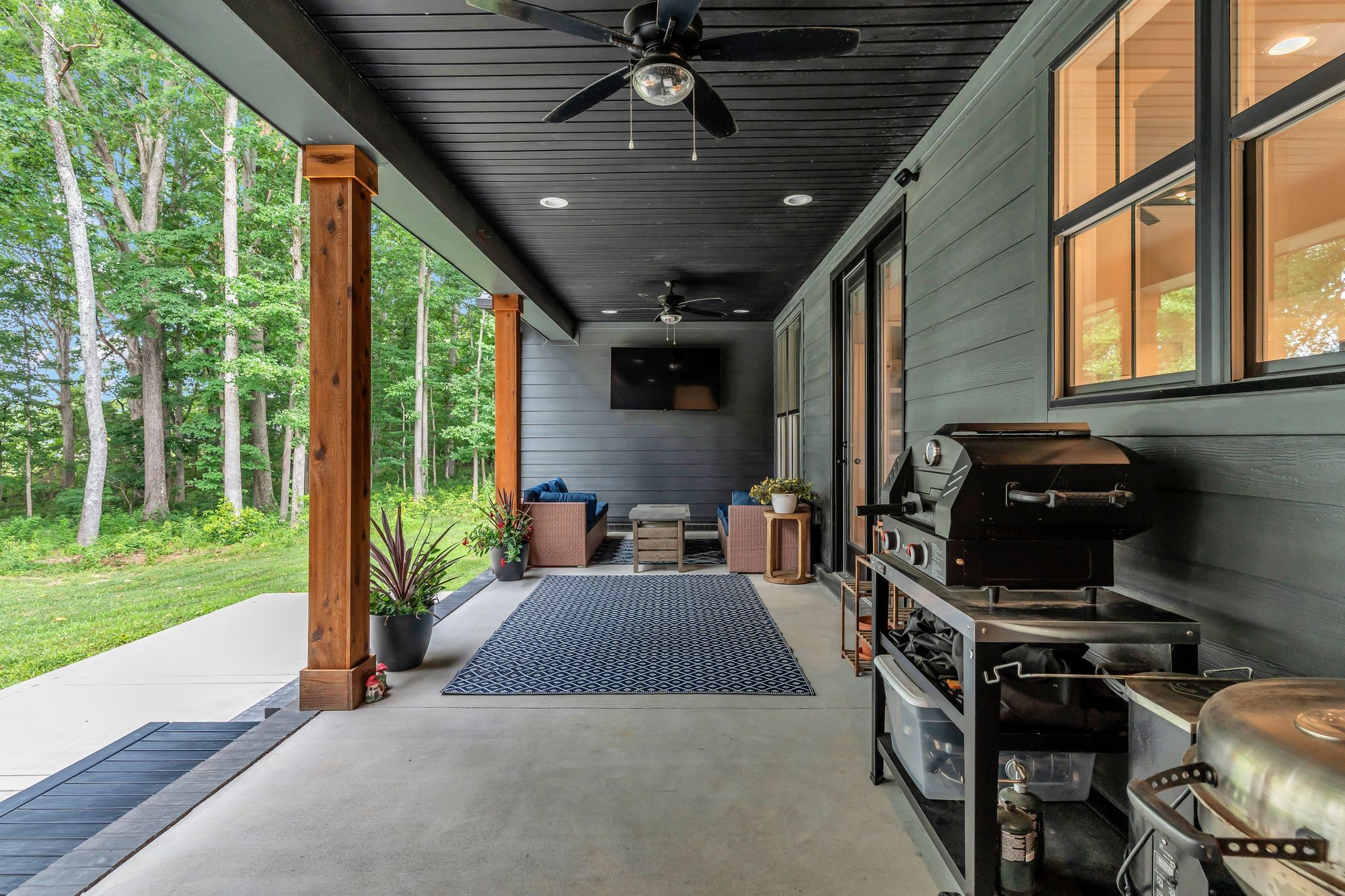 8921 Cedar Grove Road Cross Plains, TN 37049 - Photo 37 of 50 a view of a patio with chairs and a grill